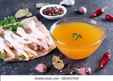 Raw Chicken Feet For Making Nutritional Bone Broth On Dark Gray Background