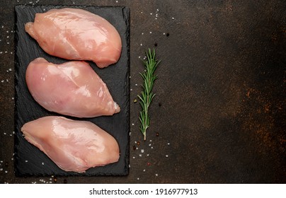 raw chicken fillet on stone background with copy space for your text
