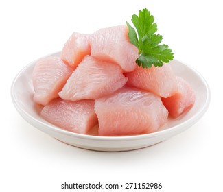 Raw Chicken Fillet. Small Pieces Of Meat Isolated On White.