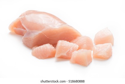 Raw Chicken Fillet. Small Pieces Of Meat Isolated On White.