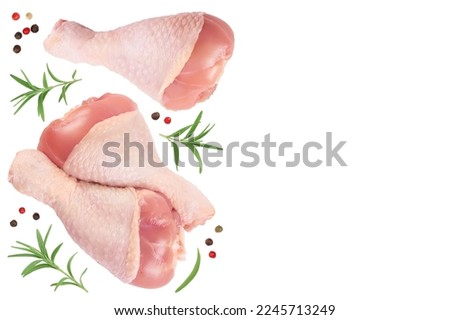 Raw chicken leg or drumstick isolated on white background with full depth of field. Top view with copy space for your text. Flat lay