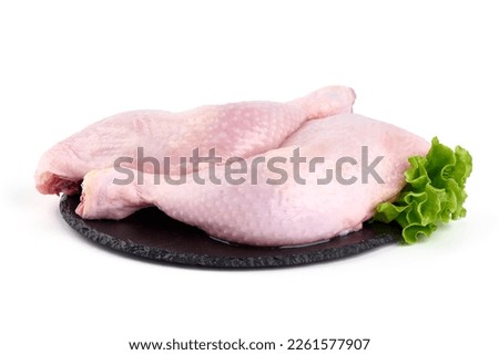 Raw chicken leg quarters, isolated on white background. High resolution image