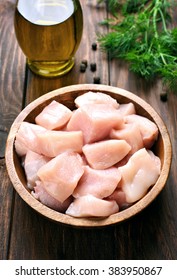 Raw Chicken Meat In Wooden Bowl