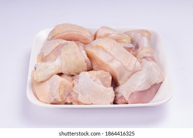 Raw Chicken Tender Curry Cut With Skin Arranged On White Plate With White Colour Background,isolated