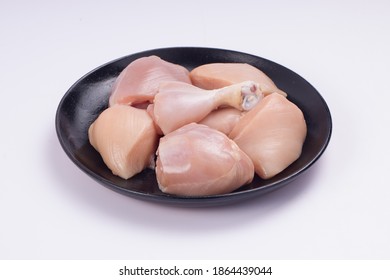 Raw Chicken Tender Curry Cut Without Skin Arranged On Black Plate With White Textured Background,isolated