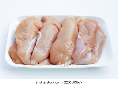 Raw Chicken Tenders On White Background.