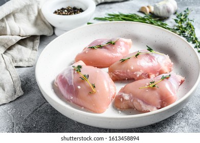 Raw Chicken Thigh Fillet. Gray Background. Top View