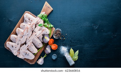 Raw Chicken Wings With Spices. On Wooden Surface. Top View.