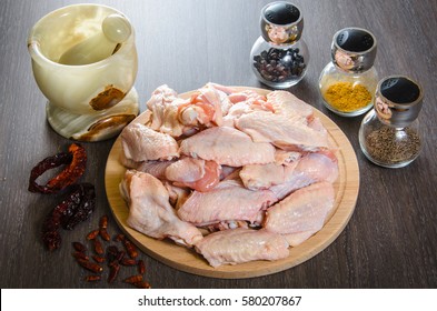 Raw chicken wings with spices - ready for cooking