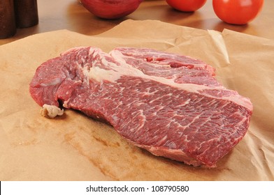 A Raw Chuck Roast On Brown Wrapping Paper