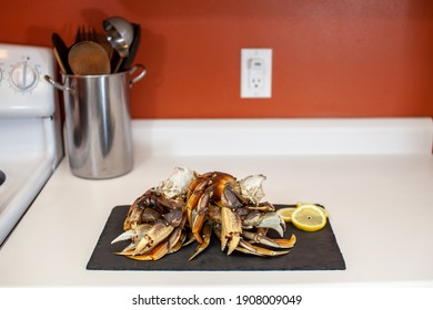 Raw, Cleaned, Uncooked Dungeness Crab Legs Sit On A Platter In The Kitchen Ready To Be Cooked For Dinner