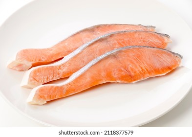 Raw Coho Salmon Fillet On White Plate