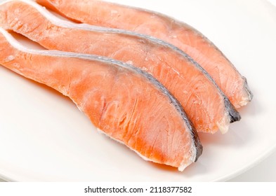 Raw Coho Salmon Fillet On White Plate