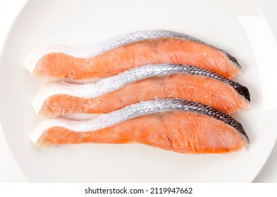 Raw Coho Salmon Fillet On White Plate