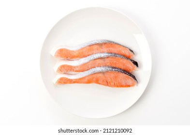 Raw Coho Salmon Fillet On White Plate