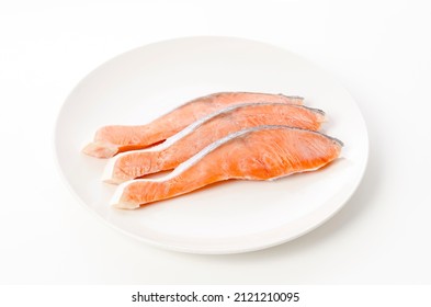 Raw Coho Salmon Fillet On White Plate