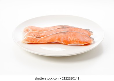 Raw Coho Salmon Fillet On White Plate