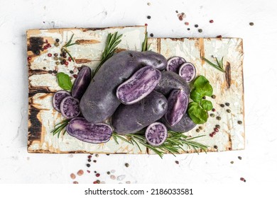 Raw Cut Purple Sweet Potatoes Isolated On White Background. Ipomoea Batatas. Batata Potato. Top View. Place For Text.