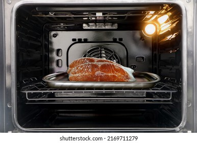 Raw cut salmon fish in the oven - Shutterstock ID 2169711279