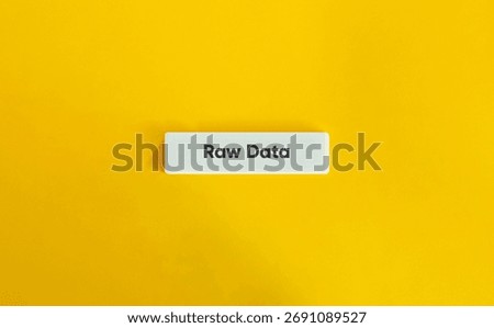 Raw Data Text on White Letter Tile over Yellow Background – Minimalist Concept Symbolizing Analytics, Technology, Information Processing, and Data Science