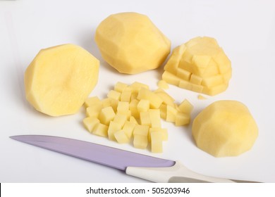 Raw diced peeled potatoes. Isolated with a white background.