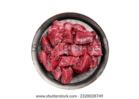 Raw Diced venison dear meat for a goulash, game meat. Isolated on white background