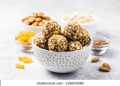 Raw dried fruit, oatmeal, nuts energy balls. Selective focus, space for text.