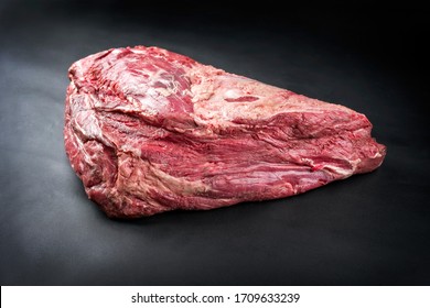 Raw Dry Aged Wagyu Beef Shoulder Clod Roast As Closeup On Black Background With Copy Space