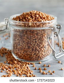 Raw Dry Buckwheat Grain  In An Open Jar Close Up 