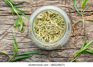 Raw and dry tarragon spice.Tarragon or Artemisia dracunculus