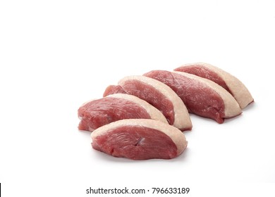 Raw duck breast pieces with skin isolated on white background