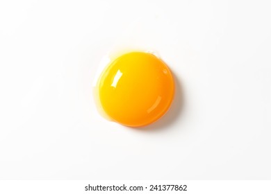 Raw Egg Yolk On White Background