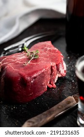 Raw Eye Fillet Steak On Black Tile