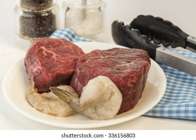 Raw Filet Mignon And Shrimp On Plate Being Prepped For The Grill.