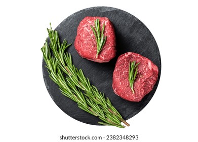 Raw Fillet Mignon Beef steak with herbs and garlic, marble meat. Isolated on white background - Powered by Shutterstock