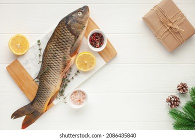 Raw Fish Carp For Preparation For The Holiday Christmas On A Background. Czech Traditional Christmas Food. Top View