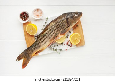 Raw Fish Carp For Preparation For The Holiday Christmas On A Background. Czech Traditional Christmas Food. Top View