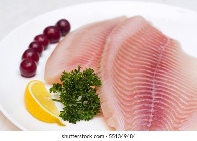 raw fish fillet white plate isolated