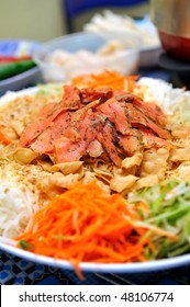 Raw Fish Salad (also Known As Yu Sheng Or Lo Hei), A Chinese New Year Delicacy