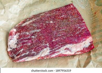 Raw Flank Steak On Butcher Paper: An Uncooked London Broil Fillet On Brown Paper Seasoned With Salt And Pepper 