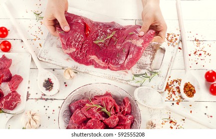 Raw Flank Steak On Wooden Table. Top View