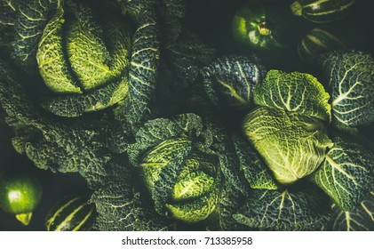 Raw fresh green cabbage texture and background, top view over dark background, selective focus - Powered by Shutterstock