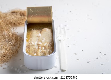 Raw And Fresh Herring In Sea Salt Water. Fish In Can With Salt And Water.