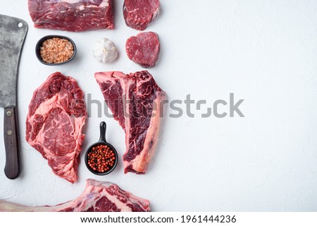 Similar – Dry aged raw tomahawk beef steak isolated on white background