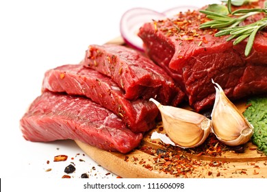 Raw Fresh Meat On Board With Condiments On White Background