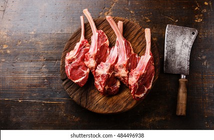 Raw Fresh Meat Veal Ribs On Butcher Wooden Block And Meat Cleaver On Wooden Background 