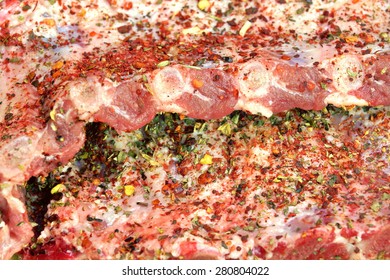 Raw Fresh Pork Baby Back Ribs With Seasoning Close-Up Background