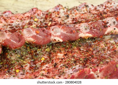 Raw Fresh Pork Baby Back Ribs With Seasoning Close-Up Background