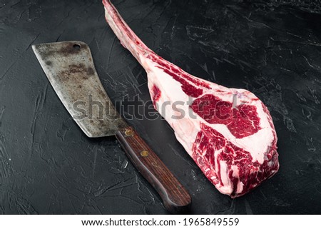 Similar – Dry aged raw tomahawk beef steak isolated on white background