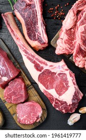 Raw Fresh Tomahawk Dry Aged Marbled Beef Chop Steak, On Black Wooden Table Background, Top View Flat Lay